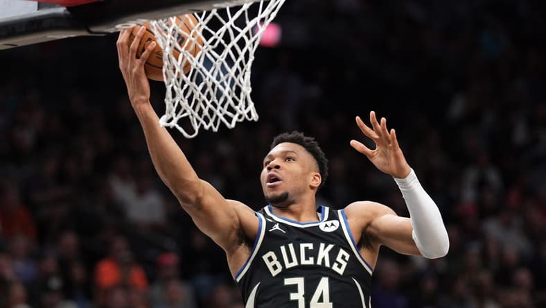 Mar 14, 2023; Phoenix, Arizona, USA; Milwaukee Bucks forward Giannis Antetokounmpo (34) puts up a layup against the Phoenix Suns during the first half at Footprint Center. Mandatory Credit: Joe Camporeale-USA TODAY Sports
