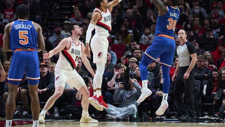 Mar 14, 2023; Portland, Oregon, USA; New York Knicks forward Julius Randle (30) shoots a jump shot during the first half against Portland Trail Blazers guard Matisse Thybulle (4) at Moda Center. Mandatory Credit: Troy Wayrynen-USA TODAY Sports
