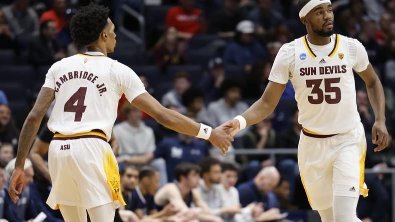 Mar 15, 2023; Dayton, OH, USA; Arizona State Sun Devils guard Desmond Cambridge Jr. (4) and Arizona State Sun Devils guard Devan Cambridge (35) celebrate a play in the first half against the Nevada Wolf Pack at UD Arena. Mandatory Credit: Rick Osentoski-USA TODAY Sports