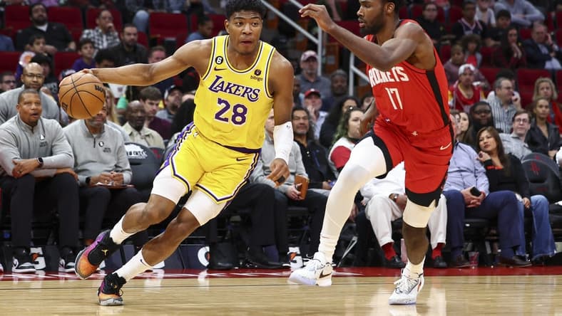 Mar 15, 2023; Houston, Texas, USA; Los Angeles Lakers forward Rui Hachimura (28) dribbles the ball as Houston Rockets forward Tari Eason (17) defends during the third quarter at Toyota Center. Mandatory Credit: Troy Taormina-USA TODAY Sports