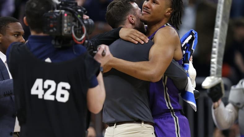 Mar 16, 2023; Orlando, FL, USA; Furman Paladins guard Mike Bothwell (3) celebrates after defeating the Virginia Cavaliers at Amway Center. Mandatory Credit: Russell Lansford-USA TODAY Sports