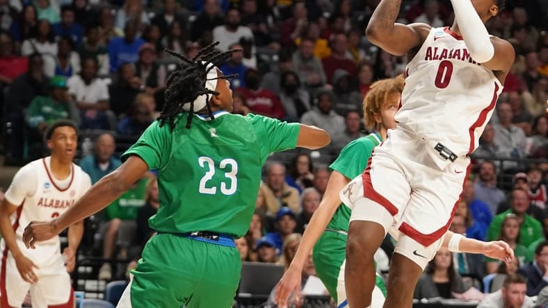 Mar 16, 2023; Birmingham, AL, USA; Alabama Crimson Tide guard Jaden Bradley (0) shoots over Texas A&M-CC Islanders guard Ross Williams (23) during the first half in the first round of the 2023 NCAA Tournament at Legacy Arena. Mandatory Credit: Marvin Gentry-USA TODAY Sports