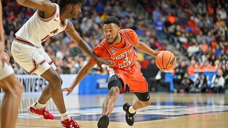 Mar 16, 2023; Des Moines, IA, USA; Illinois Fighting Illini guard Jayden Epps (3) dribbles the ball against Arkansas Razorbacks forward Makhi Mitchell (15) during the first half at Wells Fargo Arena. Mandatory Credit: Jeffrey Becker-USA TODAY Sports