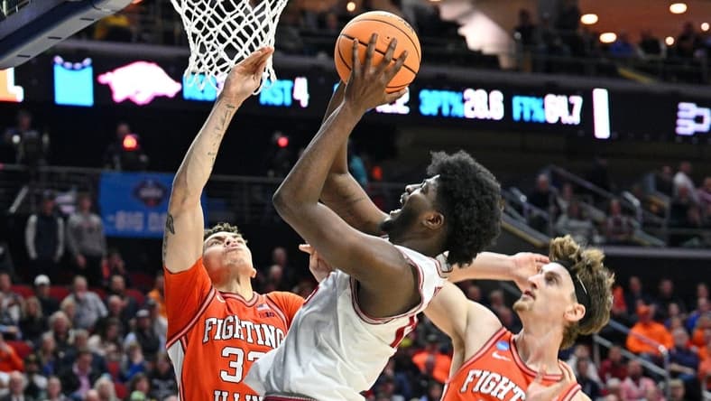 Mar 16, 2023; Des Moines, IA, USA; Arkansas Razorbacks forward Makhi Mitchell (15) shoots the ball against Illinois Fighting Illini forward Coleman Hawkins (33) and forward Matthew Mayer (24) during the first half at Wells Fargo Arena. Mandatory Credit: Jeffrey Becker-USA TODAY Sports