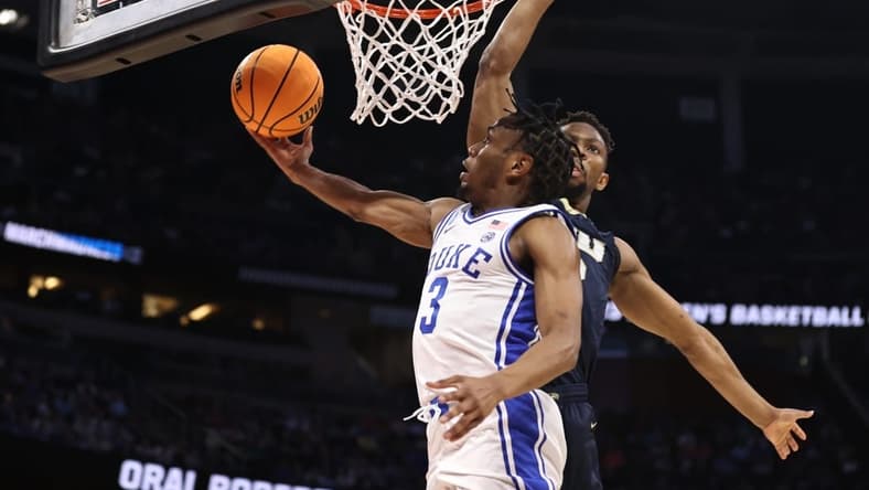 Mar 16, 2023; Orlando, FL, USA; Duke Blue Devils guard Jeremy Roach (3) goes to the basket while defended by Oral Roberts Golden Eagles forward Patrick Mwamba (32) during the first half at Amway Center. Mandatory Credit: Matt Pendleton-USA TODAY Sports
