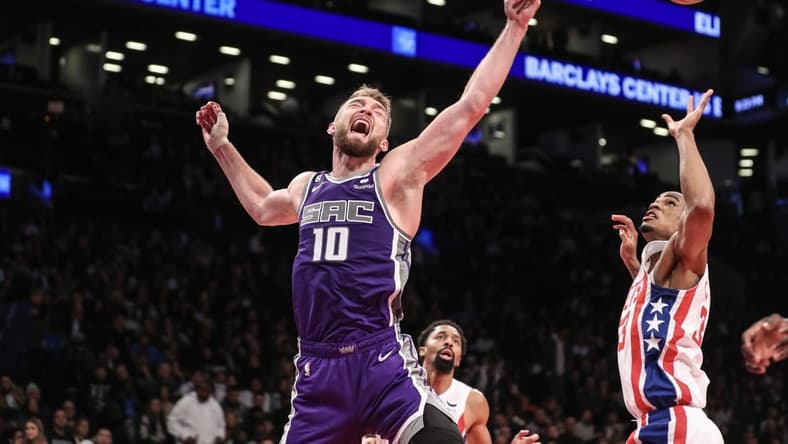 Mar 16, 2023; Brooklyn, New York, USA;  Sacramento Kings forward Domantas Sabonis (10) reacts after loosing the ball in the second quarter against the Brooklyn Nets at Barclays Center. Mandatory Credit: Wendell Cruz-USA TODAY Sports