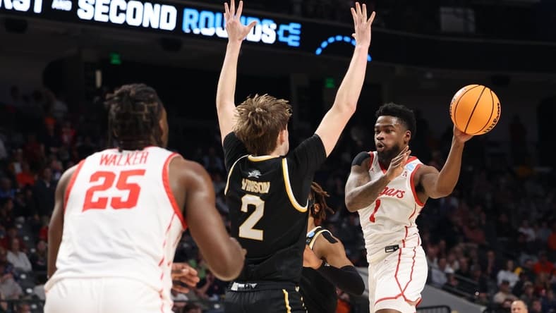 Mar 16, 2023; Birmingham, AL, USA; Houston Cougars guard Jamal Shead (1) passes the ball around Northern Kentucky Norse guard Sam Vinson (2) during the first half in the first round of the 2023 NCAA Tournament at Legacy Arena. Mandatory Credit: Vasha Hunt-USA TODAY Sports