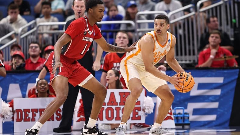Mar 16, 2023; Orlando, FL, USA; Tennessee Volunteers guard Tyreke Key (4) controls the ball while defended by Louisiana Ragin Cajuns forward Joe Charles (1) during the first half at Amway Center. Mandatory Credit: Matt Pendleton-USA TODAY Sports