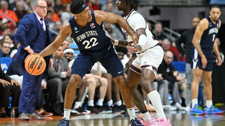 Mar 16, 2023; Des Moines, IA, USA; Penn State Nittany Lions guard Jalen Pickett (22) dribbles the ball against Texas A&M Aggies guard Manny Obaseki (35) during the first half at Wells Fargo Arena. Mandatory Credit: Jeffrey Becker-USA TODAY Sports