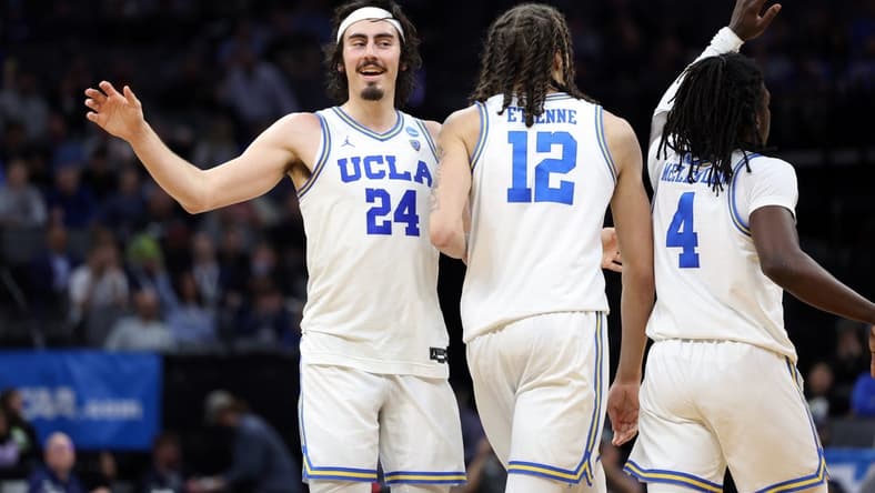 Mar 16, 2023; Sacramento, CA, USA; UCLA Bruins guard/forward Jaime Jaquez (24) and forward Mac Etienne (12) react in the second half against the UNC Asheville Bulldogs at Golden 1 Center. Mandatory Credit: Kelley L Cox-USA TODAY Sports