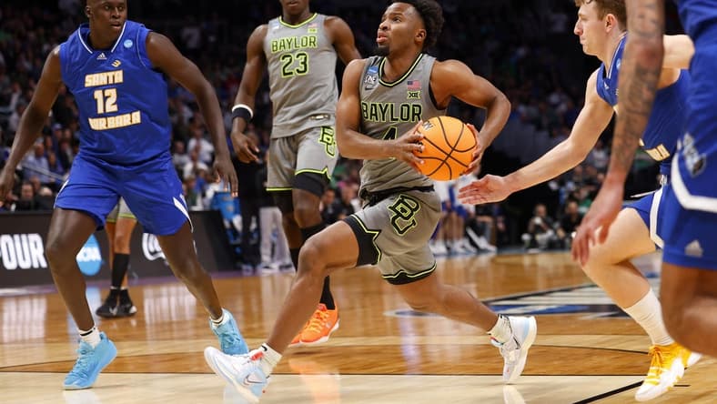 Mar 17, 2023; Denver, CO, USA; Baylor Bears guard LJ Cryer (4) drives to the basket as UC Santa Barbara Gauchos forward Evans Kipruto (12) defends during the second half in the first round of the 2023 NCAA men s basketball tournament at Ball Arena. Mandatory Credit: Michael Ciaglo-USA TODAY Sports