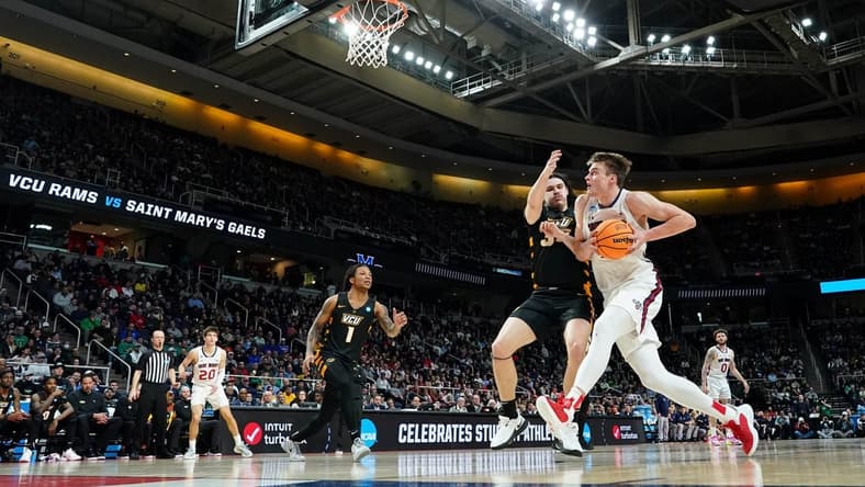 Mar 17, 2023; Albany, NY, USA; St. Mary's Gaels center Mitchell Saxen (11) drives to the basket against Virginia Commonwealth Rams forward David Shriver (35) during the first half at MVP Arena. Mandatory Credit: David Butler II-USA TODAY Sports