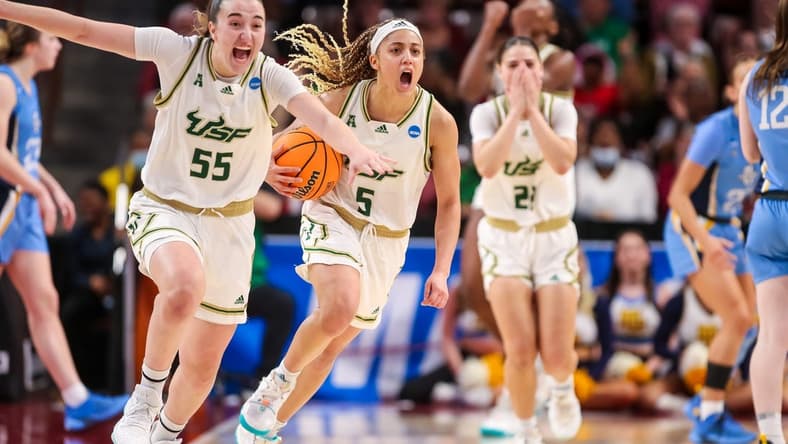Mar 17, 2023; Columbia, SC, USA; South Florida Bulls guard Carla Brito (55) and guard Elena Tsineke (5) celebrate their win over the Marquette Golden Eagles in the first round of the 2023 NCAA Division 1 women s basketball tournament at Colonial Life Arena. Mandatory Credit: Jeff Blake-USA TODAY Sports