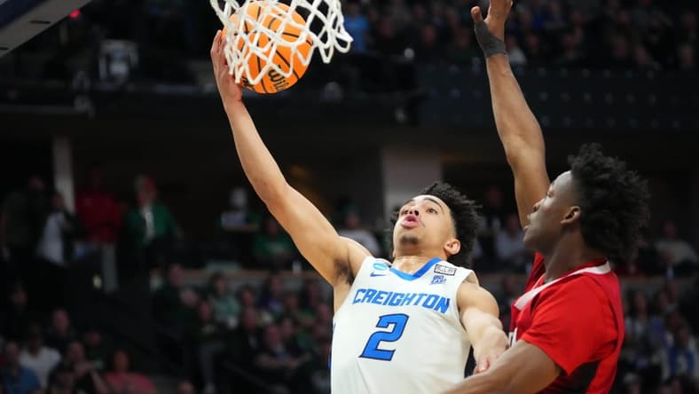 Mar 17, 2023; Denver, CO, USA; Creighton Bluejays guard Ryan Nembhard (2) drives to the basket as North Carolina State Wolfpack guard Jarkel Joiner (1) defends during the second half in the first round of the 2023 NCAA men s basketball tournament at Ball Arena. Mandatory Credit: Ron Chenoy-USA TODAY Sports