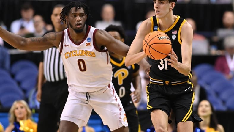 Mar 17, 2023; Greensboro, NC, USA; Pittsburgh Panthers forward Jorge Diaz Graham (31) passes the ball while defended by Iowa State Cyclones forward Tre King (0) during the second half at Greensboro Coliseum. Mandatory Credit: Bob Donnan-USA TODAY Sports