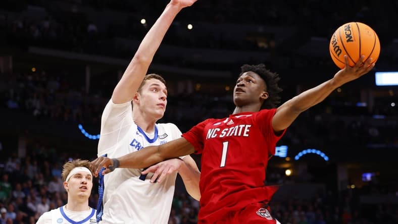 Mar 17, 2023; Denver, CO, USA; North Carolina State Wolfpack guard Jarkel Joiner (1) shoots for the basket as Creighton Bluejays center Ryan Kalkbrenner (11) defends during the second half in the first round of the 2023 NCAA men s basketball tournament at Ball Arena. Mandatory Credit: Michael Ciaglo-USA TODAY Sports