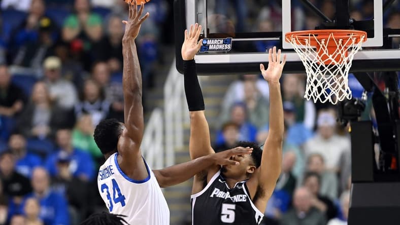 Mar 17, 2023; Greensboro, NC, USA; Kentucky Wildcats forward Oscar Tshiebwe (34) shoots against Providence Friars forward Ed Croswell (5) in the first half at Greensboro Coliseum. Mandatory Credit: Bob Donnan-USA TODAY Sports