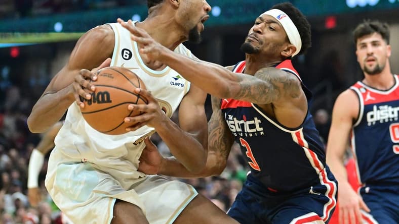 Mar 17, 2023; Cleveland, Ohio, USA; Cleveland Cavaliers forward Evan Mobley (4) drives to the basket against Washington Wizards guard Bradley Beal (3) during the first half at Rocket Mortgage FieldHouse. Mandatory Credit: Ken Blaze-USA TODAY Sports