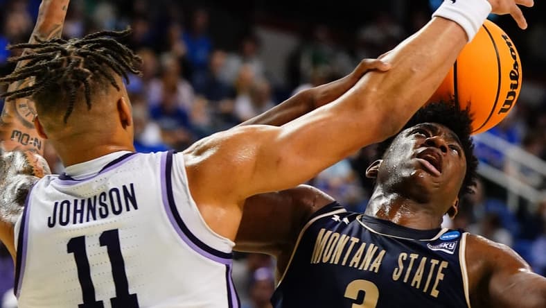 Mar 17, 2023; Greensboro, NC, USA; Kansas State Wildcats forward Keyontae Johnson (11) defends against Montana State Bobcats forward Great Osobor (3) for a rebound in the first half at Greensboro Coliseum. Mandatory Credit: John David Mercer-USA TODAY Sports