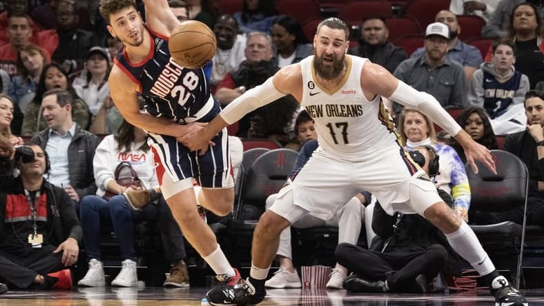 Mar 17, 2023; Houston, Texas, USA; Houston Rockets center Alperen Sengun (28) knocks the ball from New Orleans Pelicans center Jonas Valanciunas (17) in the fourth quarter at Toyota Center. Mandatory Credit: Thomas Shea-USA TODAY Sports