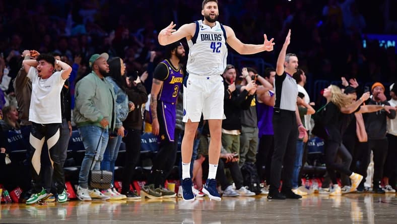 Mar 17, 2023; Los Angeles, California, USA; Dallas Mavericks forward Maxi Kleber (42) reacts after scoring a three point basket against Los Angeles Lakers forward Anthony Davis (3) for the game victory during the second half at Crypto.com Arena. Mandatory Credit: Gary A. Vasquez-USA TODAY Sports