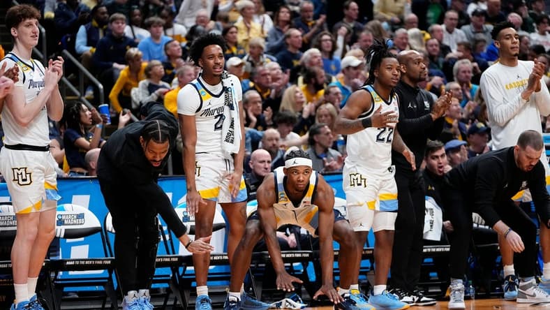 Mar 17, 2023; Columbus, Ohio, USA;  Marquette Golden Eagles players react during the first round of the NCAA men   s basketball tournament against the Vermont Catamounts at Nationwide Arena. Marquette won 78-61. Mandatory Credit: Adam Cairns-The Columbus Dispatch

Basketball Ncaa Men S Basketball Tournament