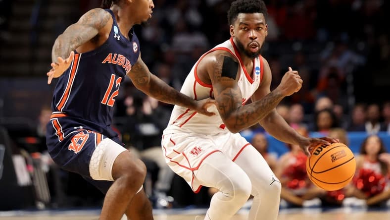 Mar 18, 2023; Birmingham, AL, USA; Houston Cougars guard Jamal Shead (1) dribbles against Auburn Tigers guard Zep Jasper (12) during the first half at Legacy Arena. Mandatory Credit: Vasha Hunt-USA TODAY Sports