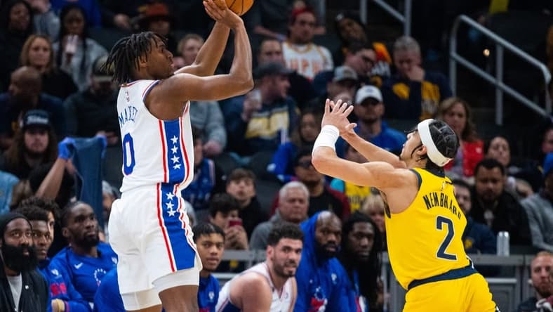Mar 18, 2023; Indianapolis, Indiana, USA; Philadelphia 76ers guard Tyrese Maxey (0) shoots the ball while  Indiana Pacers guard Andrew Nembhard (2) defends in the second quarter at Gainbridge Fieldhouse. Mandatory Credit: Trevor Ruszkowski-USA TODAY Sports