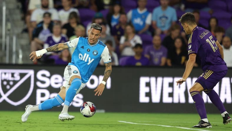 Mar 18, 2023; Orlando, Florida, USA; Charlotte FC forward Enzo Copetti (9) takes on Orlando City SC defender Rodrigo Schlegel (15) during the first half at Exploria Stadium. Mandatory Credit: Nathan Ray Seebeck-USA TODAY Sports