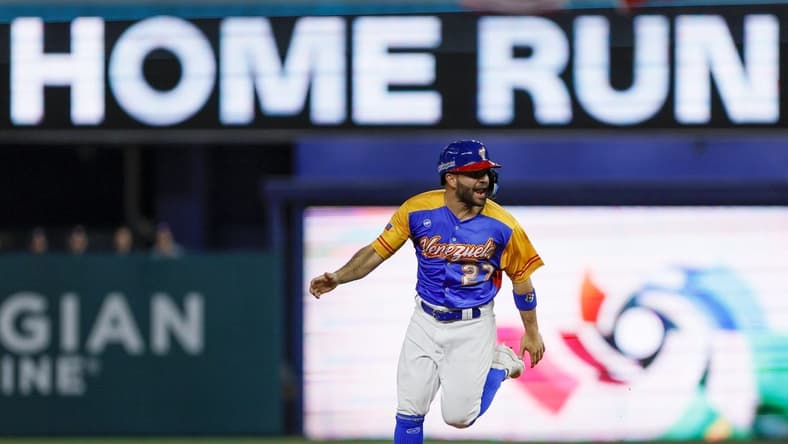 Mar 18, 2023; Miami, Florida, USA; Venezuela second baseman Jose Altuve (27) circles the bases after a two-run home run from first baseman Luis Arraez (not pictured) during the first inning against the USA at LoanDepot Park. Mandatory Credit: Sam Navarro-USA TODAY Sports