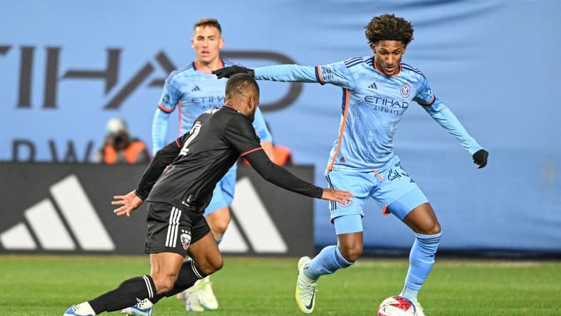 Mar 18, 2023; New York, New York, USA; New York City FC forward Talles Magno (43) dribbles the ball defended by D.C. United defender Ruan (2) during the first half at Yankee Stadium. Mandatory Credit: Mark Smith-USA TODAY Sports