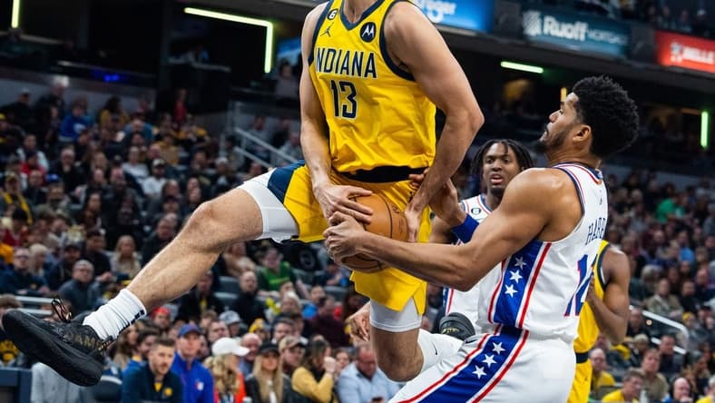 Mar 18, 2023; Indianapolis, Indiana, USA; Indiana Pacers forward Jordan Nwora (13) shoots the ball while Philadelphia 76ers forward Tobias Harris (12) defends in the first quarter at Gainbridge Fieldhouse. Mandatory Credit: Trevor Ruszkowski-USA TODAY Sports