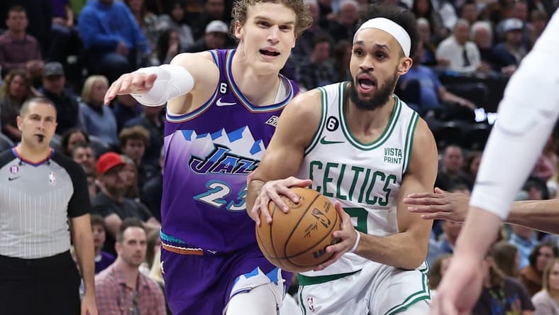 Mar 18, 2023; Salt Lake City, Utah, USA; Boston Celtics guard Derrick White (9) drives on Utah Jazz forward Lauri Markkanen (23) in the first quarter at Vivint Arena. Mandatory Credit: Rob Gray-USA TODAY Sports