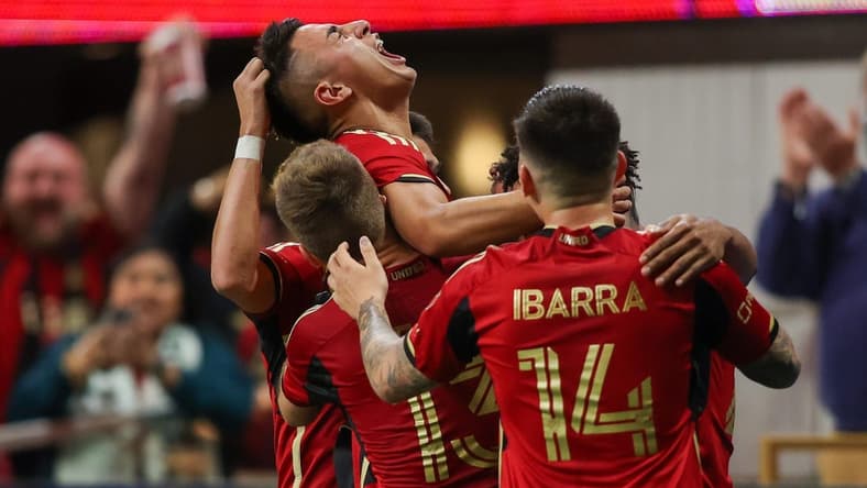 Mar 18, 2023; Atlanta, Georgia, USA; Atlanta United midfielder Thiago Almada (23) celebrates with teammates after a goal against the Portland Timbers at Mercedes-Benz Stadium. Mandatory Credit: Brett Davis-USA TODAY Sports