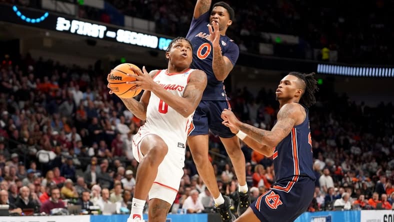 Mar 18, 2023; Birmingham, AL, USA; Houston Cougars guard Marcus Sasser (0) drives past Auburn Tigers guard K.D. Johnson (0) during the second half at Legacy Arena. Mandatory Credit: Marvin Gentry-USA TODAY Sports