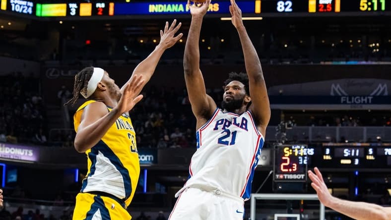 Mar 18, 2023; Indianapolis, Indiana, USA; Philadelphia 76ers center Joel Embiid (21) shoots the ball while Indiana Pacers center Myles Turner (33) defends in the second half at Gainbridge Fieldhouse. Mandatory Credit: Trevor Ruszkowski-USA TODAY Sports