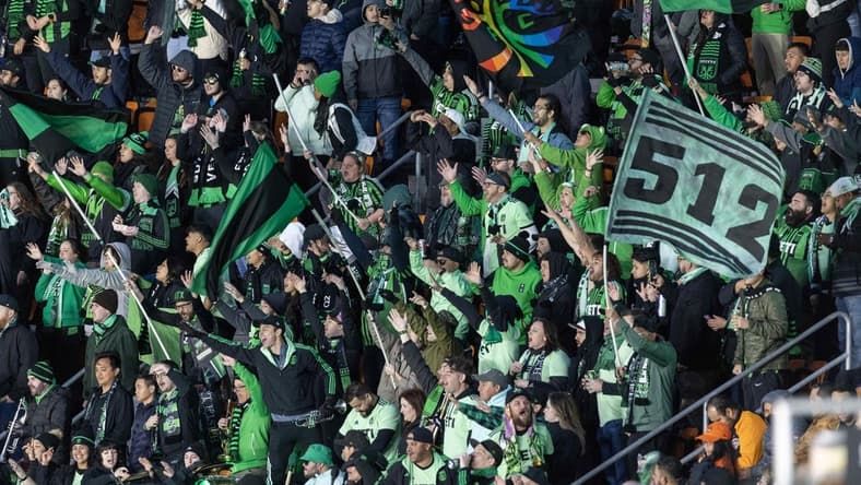 Mar 18, 2023; Houston, Texas, USA;  Fans cheer for Austin FC as they play against the Houston Dynamo FC in the first half at Shell Energy Stadium. Mandatory Credit: Thomas Shea-USA TODAY Sports