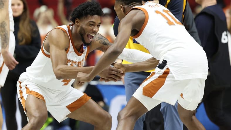 Mar 18, 2023; Des Moines, IA, USA; Texas Longhorns guard Tyrese Hunter (4) and guard Sir'Jabari Rice (10) celebrate after defeating the Penn State Nittany Lions at Wells Fargo Arena. Mandatory Credit: Reese Strickland-USA TODAY Sports