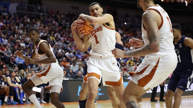 Mar 18, 2023; Des Moines, IA, USA;  Texas Longhorns forward Dylan Disu (1) grabs a rebound against the Penn State Nittany Lions during the second half at Wells Fargo Arena. Mandatory Credit: Reese Strickland-USA TODAY Sports