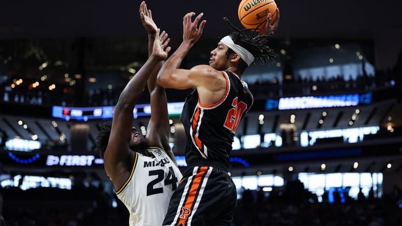 Mar 18, 2023; Sacramento, CA, USA; Princeton Tigers forward Tosan Evbuomwan (20) attempts a pass while defended by Missouri Tigers guard Kobe Brown (24) during the second half at Golden 1 Center. Mandatory Credit: Kelley L Cox-USA TODAY Sports
