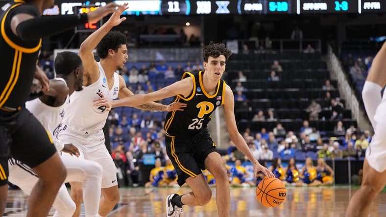 Mar 19, 2023; Greensboro, NC, USA; Pittsburgh Panthers forward Guillermo Diaz Graham (25) drives to the basket against Xavier Musketeers forward Cesare Edwards (4) during the first half in the second round of the 2023 NCAA men s basketball tournament at Greensboro Coliseum. Mandatory Credit: Bob Donnan-USA TODAY Sports