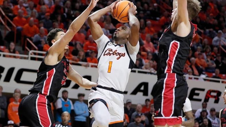 Oklahoma State Cowboys guard Bryce Thompson (1) puts up a shot between Eastern Washington Eagles forward Angelo Allegri (13), left,  and forward Dane Erikstrup (32) during a college basketball game between the Oklahoma State Cowboys (OSU) and the Eastern Washington Eagles in the second round of the NIT at Gallagher-Iba Arena in Stillwater, Okla., Sunday, March 19, 2023.

Osu Nit