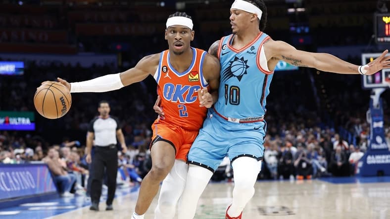 Mar 19, 2023; Oklahoma City, Oklahoma, USA; Oklahoma City Thunder guard Shai Gilgeous-Alexander (2) drives against Phoenix Suns guard Damion Lee (10) during the second quarter at Paycom Center. Mandatory Credit: Alonzo Adams-USA TODAY Sports