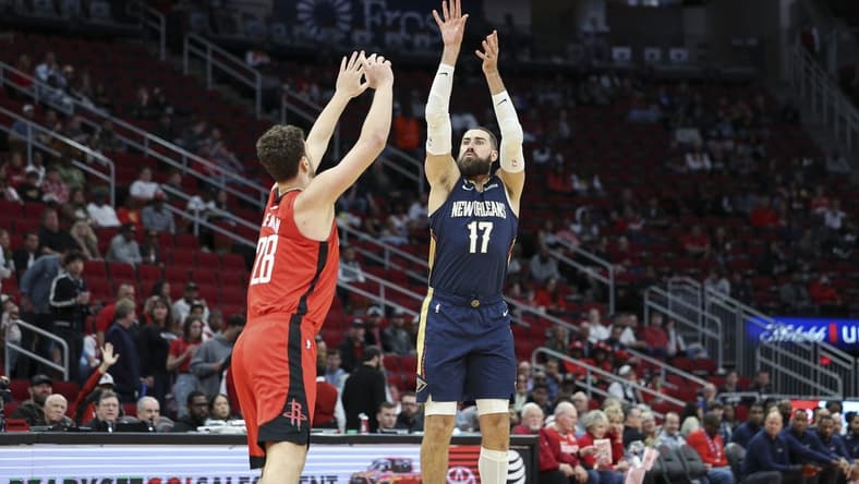 Mar 19, 2023; Houston, Texas, USA; New Orleans Pelicans center Jonas Valanciunas (17) shoots the ball over Houston Rockets center Alperen Sengun (28) during the first quarter at Toyota Center. Mandatory Credit: Troy Taormina-USA TODAY Sports