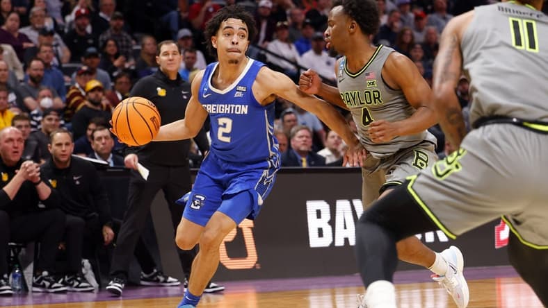 Mar 19, 2023; Denver, CO, USA; Creighton Bluejays guard Ryan Nembhard (2) controls the ball against Baylor Bears guard LJ Cryer (4) in the first half at Ball Arena. Mandatory Credit: Michael Ciaglo-USA TODAY Sports