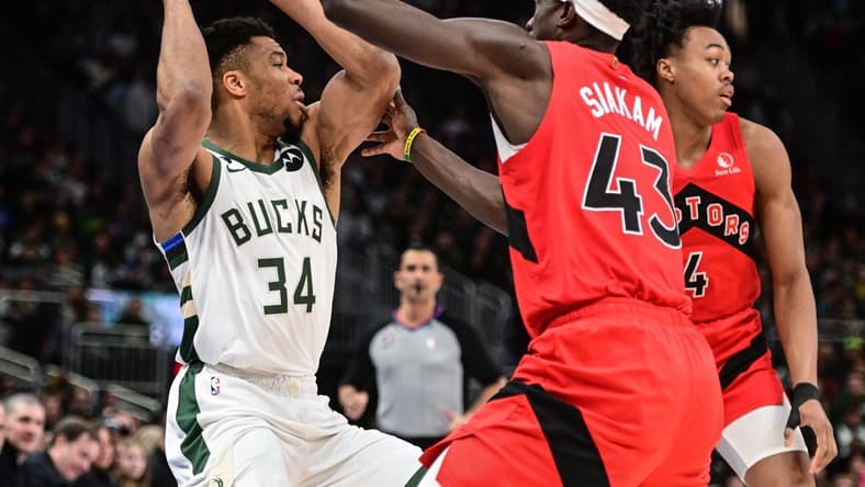 Mar 19, 2023; Milwaukee, Wisconsin, USA; Milwaukee Bucks forward Giannis Antetokounmpo (34) looks for a shot against Toronto Raptors forward Pascal Siakam (43) in the first quarter at Fiserv Forum. Mandatory Credit: Benny Sieu-USA TODAY Sports