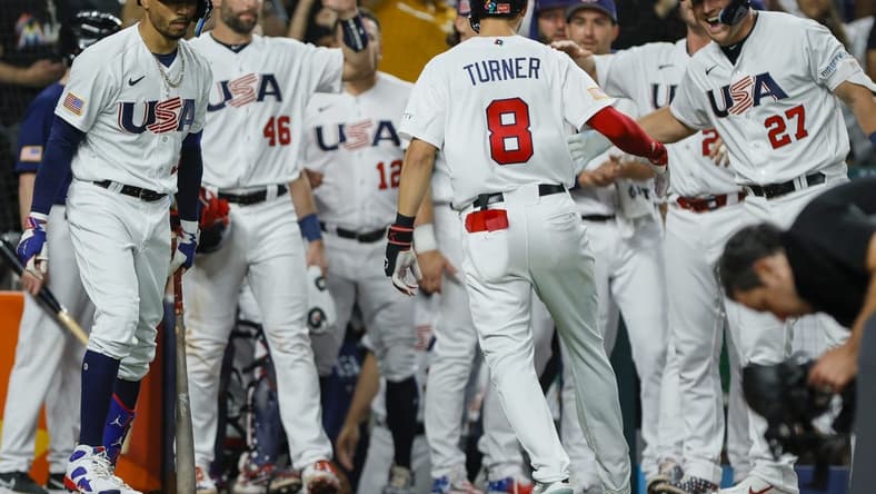 Mar 19, 2023; Miami, Florida, USA; USA shortstop Trea Turner (8) celebrates with teammates after hitting a home run during the second inning against Cuba at LoanDepot Park. Mandatory Credit: Sam Navarro-USA TODAY Sports