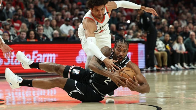 Mar 19, 2023; Portland, Oregon, USA; Portland Trail Blazers forward Greg Brown III (4) defends LA Clippers forward Kawhi Leonard (2) in the first half at Moda Center. Mandatory Credit: Jaime Valdez-USA TODAY Sports