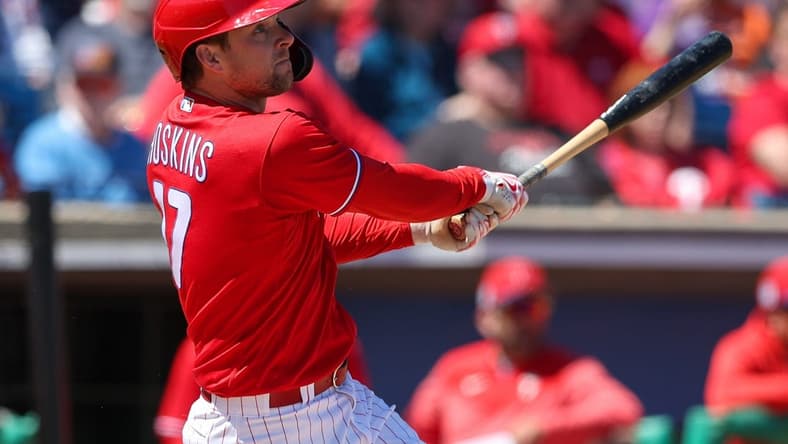 Mar 20, 2023; Clearwater, Florida, USA; Philadelphia Phillies first baseman Rhys Hoskins (17) hits a two-run home run against the Baltimore Orioles in the second inning during spring training at BayCare Ballpark. Mandatory Credit: Nathan Ray Seebeck-USA TODAY Sports