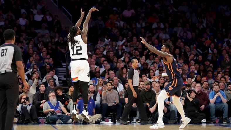 Mar 20, 2023; New York, New York, USA; Minnesota Timberwolves forward Taurean Prince (12) shoots a three point shot over New York Knicks forward Julius Randle (30) during the fourth quarter at Madison Square Garden. Mandatory Credit: Brad Penner-USA TODAY Sports